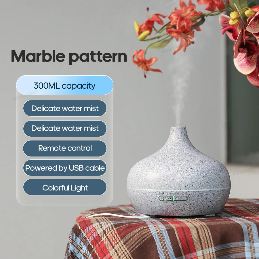 Gray diffuser on a plaid surface with marble pattern text and features listed.